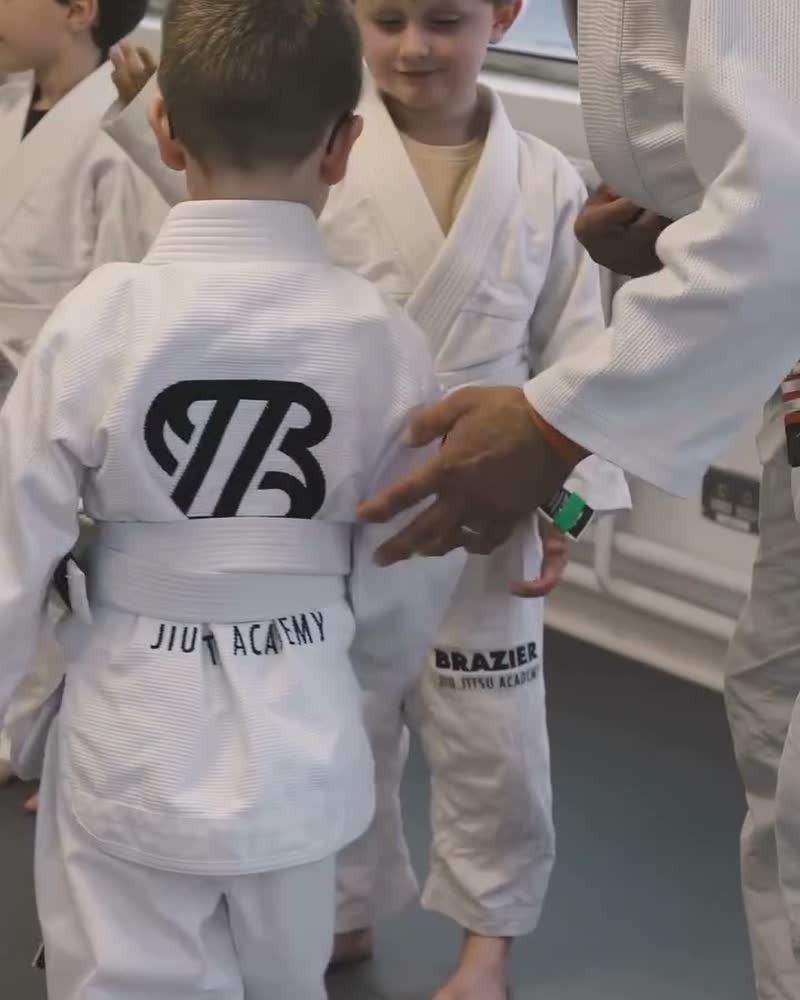 Kids lined up in Brazier kimonos before class