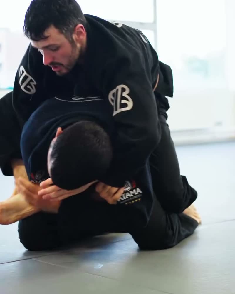 A coach passing the guard during a roll